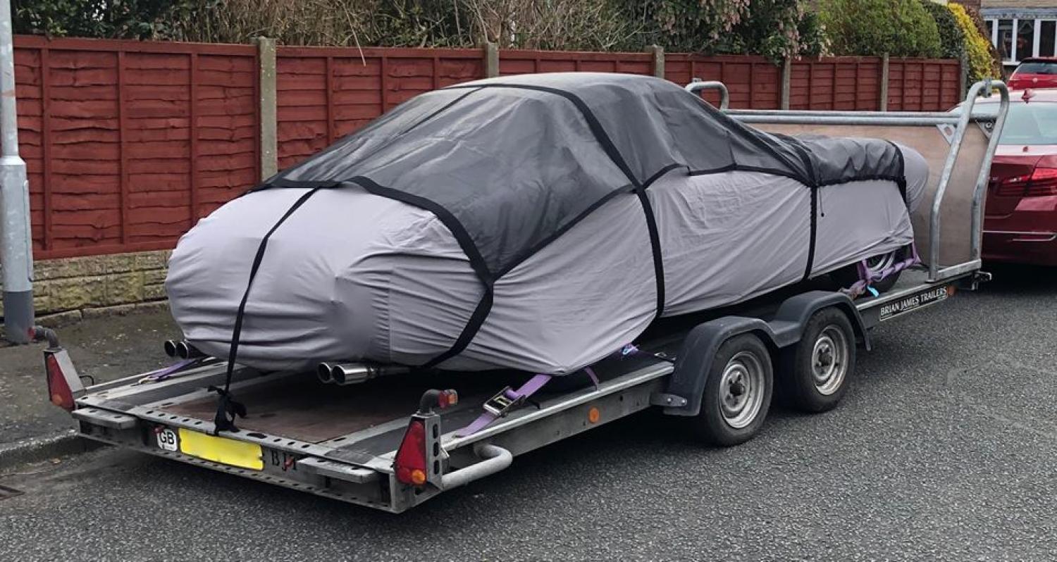 covered in car transporter